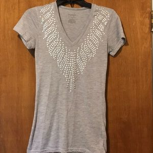 Super cute tee with metal detail!